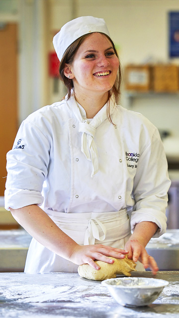 Catering student kneads dough
