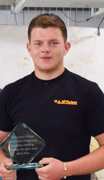 Alfie, brickwork apprentice holds SurreyFE construction skills award