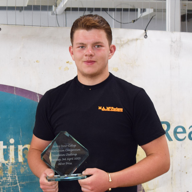 Alfie, brickwork apprentice holds SurreyFE construction skills award