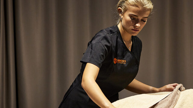 Beauty therapy student performs massage in Brooks Salon