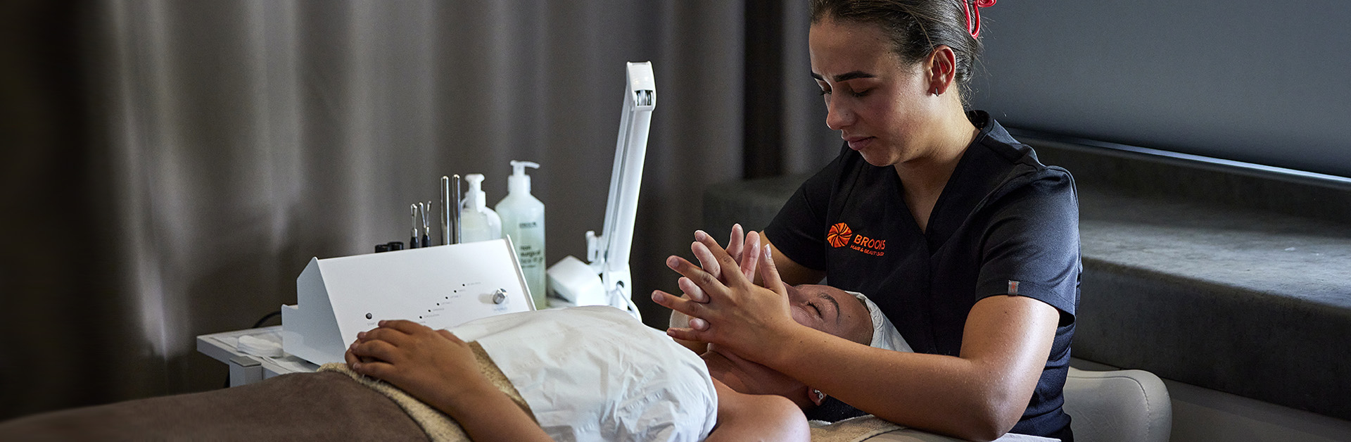 Beauty therapy student performs massage in Brooks Salon