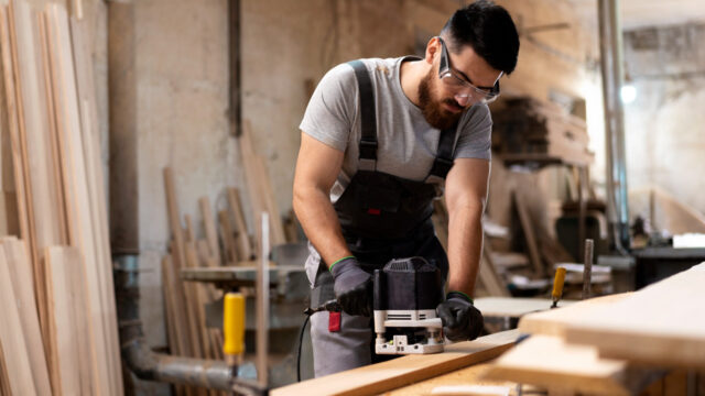Carpenter cutting wood