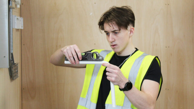 Student shows off electrical equipment