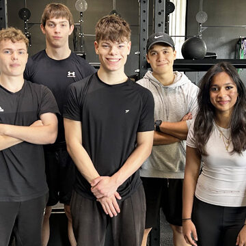Sport students gather round for photo opportunity at LOCKER Gym in Addlestone