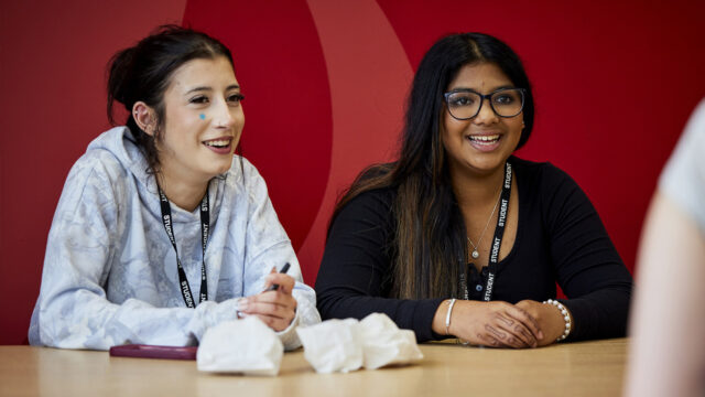 Students chat in college canteen, Brooks cafe.