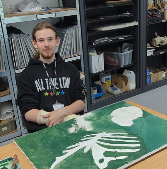 Art and design student, Troy, shows off artwork in interview